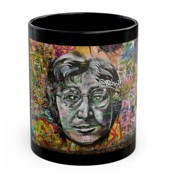Black mug printed with a colorful graffiti portrait from a wall in Prague